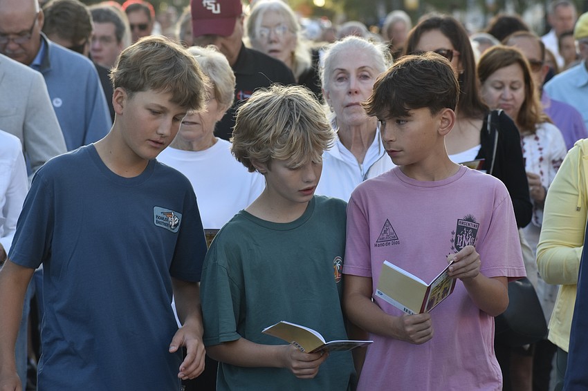 Tanner Bobb, Mitchell Wrigley and Arch Long, seventh graders who attend Church of the Redeemer, walk along together.