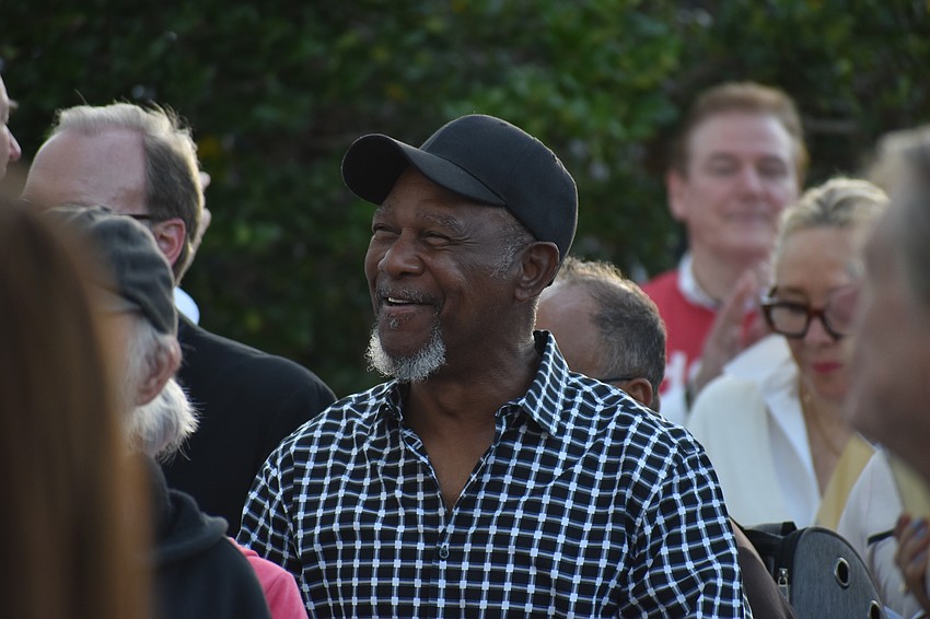 Rev. Wesley Tunstall Jr. listens as Melinda Drake, worship leader of Vision Church, sings 