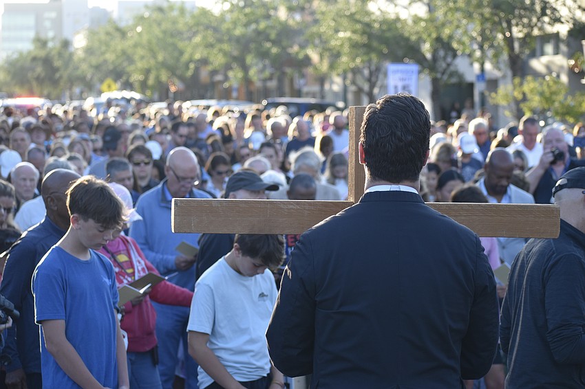 Rev. David Svihel stands before the crowd.