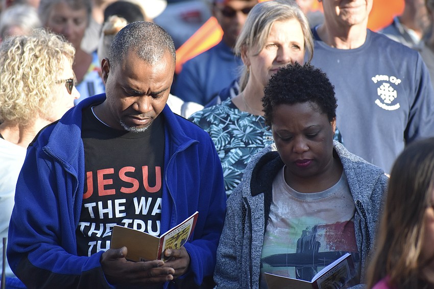 Stanley Prophet and his wife Rose Prophet participate in a devotion at one of the stations.