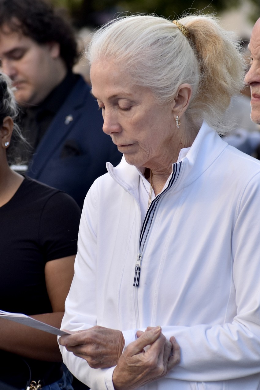 Kim Pulliam follows along during a devotion.