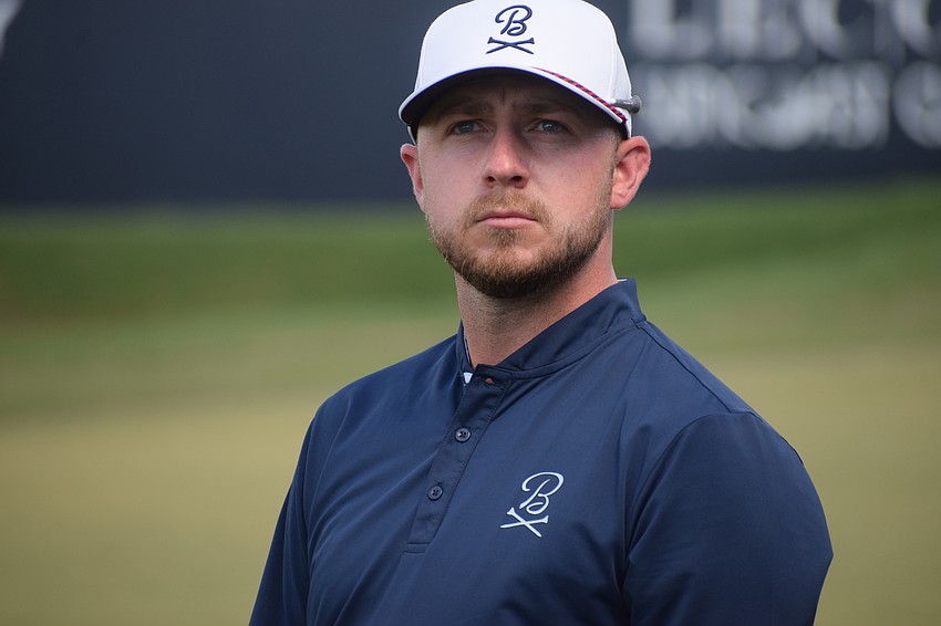 Alistair Docherty looks into the crowd on the 18th green after wind upended an umbrella to cause commotion. Docherty tied for the low score of the third round with a six-under 65.