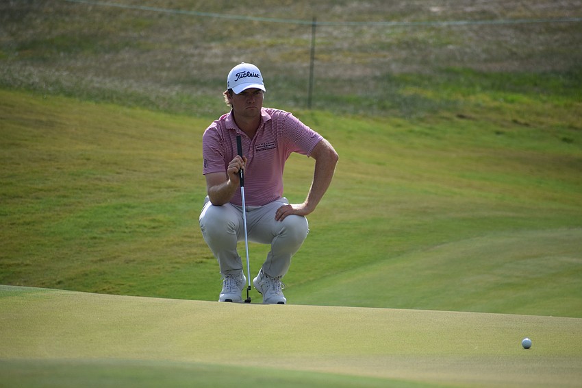 Austin Hitt studies his birdie putt on the par-3 No. 15 at Lakewood National during the third round of play on Friday.