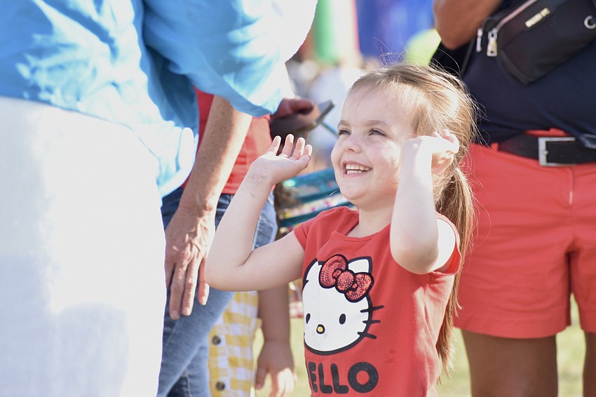 Londyn Woodcock, 5, prepares for a hand slap with the Easter Bunny.