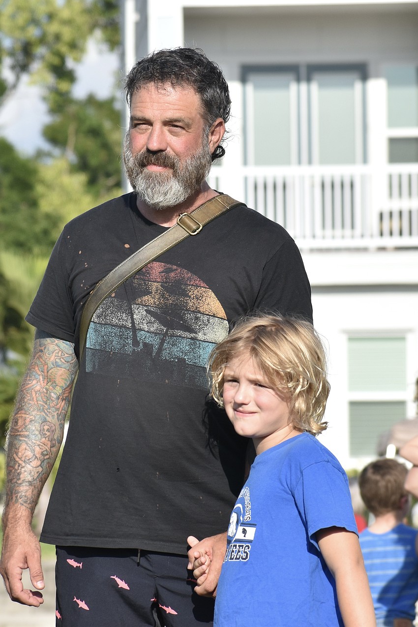 Brian Wagner and his son Deckard Wagner, 7, prepare to meet the Easter Bunny.