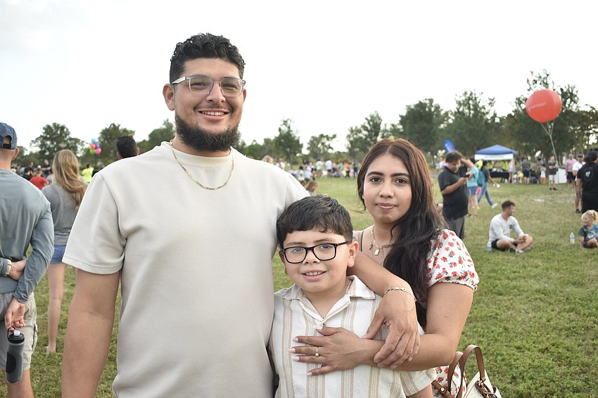 Leo Ambriz, his son, Leonidas Abriz, 8, and his wife Genesis Ambriz attended the event.