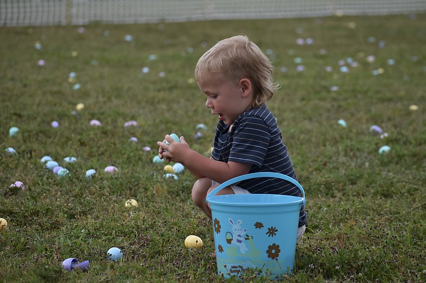 Ro Pikat, 2, finds an Easter egg.