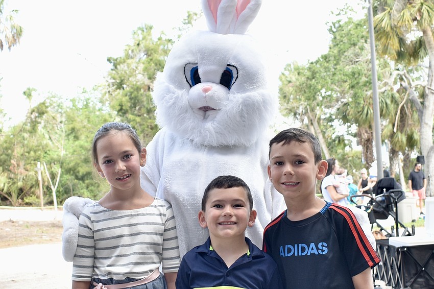 Siblings Pippa Neff, 9, Archer Neff, 4 and Axel Neff, 6, meet the Easter Bunny.