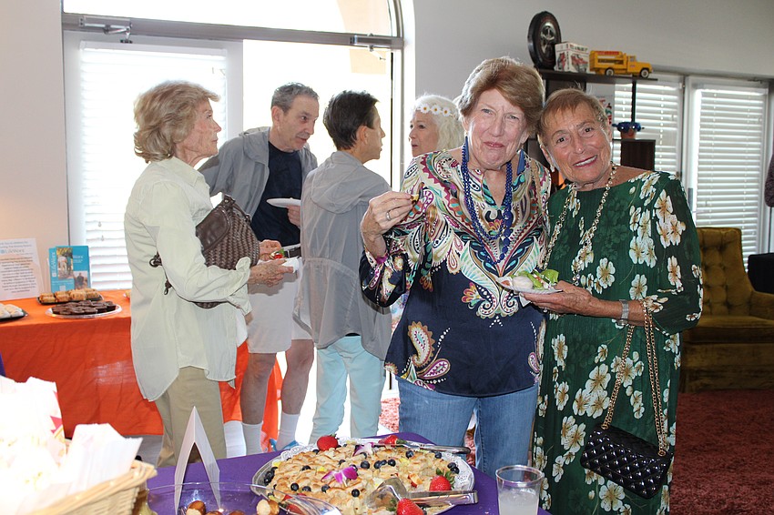 Linda Rhault and Merte Nelson dress on theme for The Paradise Center's end-of-season party.