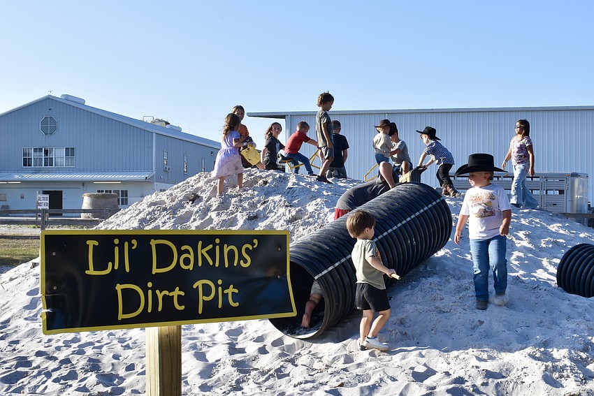 The little cowboys have plenty of partners to play with before the bull riding begins.