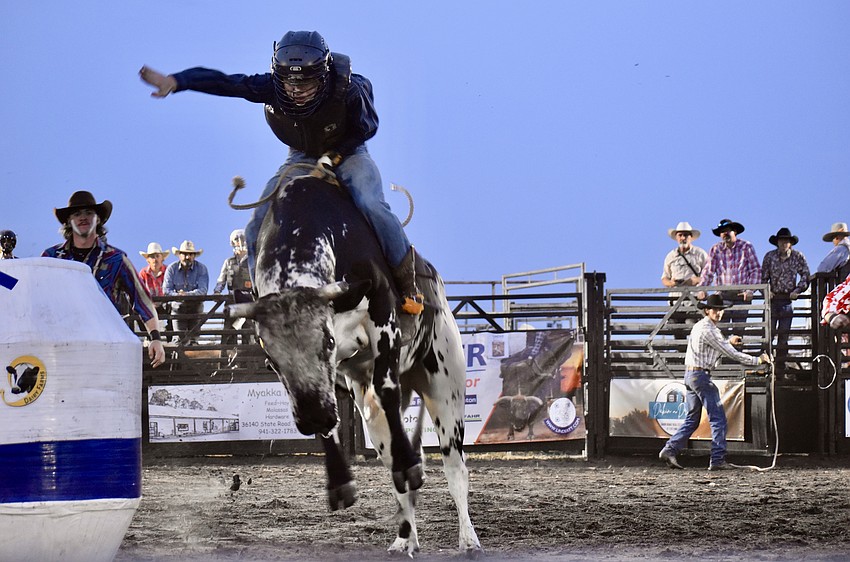 Arcadia's Whitley Stewart earns a high score for staying on the bull so long during the Dakin Bull Bash April 19 in Myakka City.