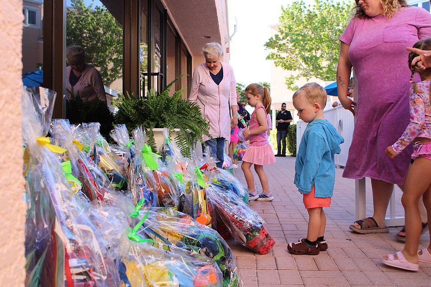 Deciding on an Easter prize basket is no easy task after the egg hunt at Sand Cay.
