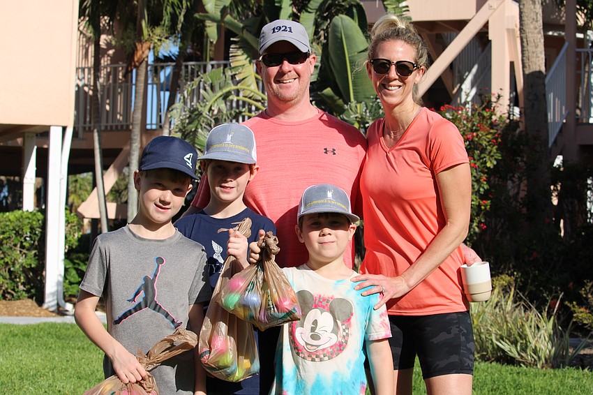 Callan, 9, Jack, 7, and Declan, 6, display their Easter egg haul with parents Brian and Tracy. The Murray family is visiting from another island, Long Island in New York.