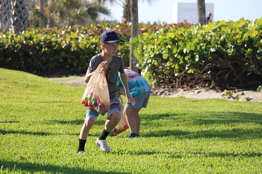 Jack Murray, 7, zips across the Sand Cay lawn in search of Easter eggs.