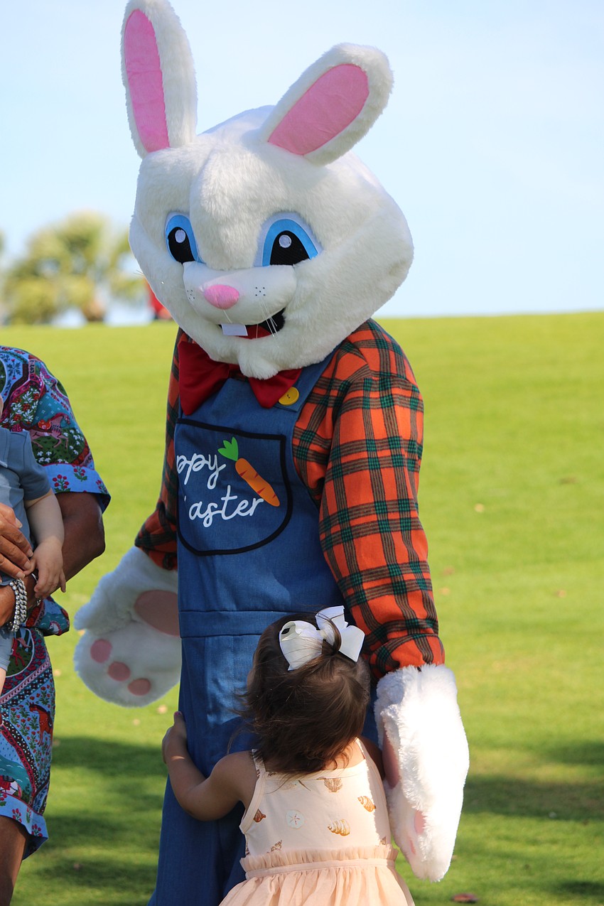 The Easter Bunny doles out hugs before the egg hunt begins at the Longboat Key Club Resort.