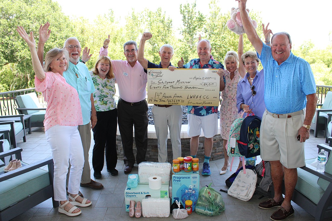 Stillpoint Mission's Marge Slepica, Gene Tischer, Linda Burman, Gary Scott and Jim Keiner and Annual Appeal fundraisers Bob Smith, Diane Brune, Judy Balmer and Bob Keehn celebrate the record $84,017 raised.