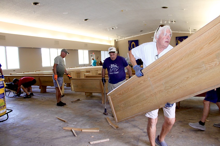 Volunteers quickly set to work, clearing 36 pews with new chairs in an hour.