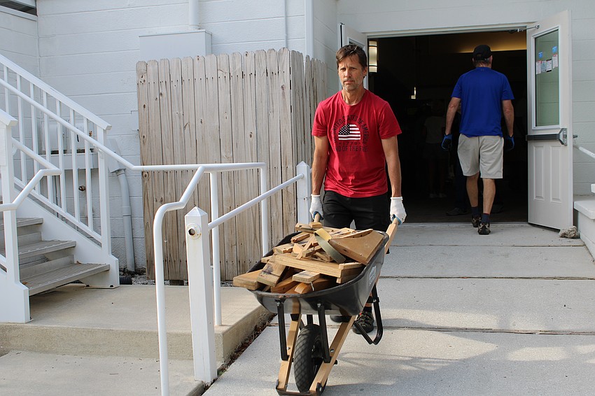 Crews set to their tasks, keeping a continuous flow of sledgehammering, removing wood and clearing way for the new chairs.