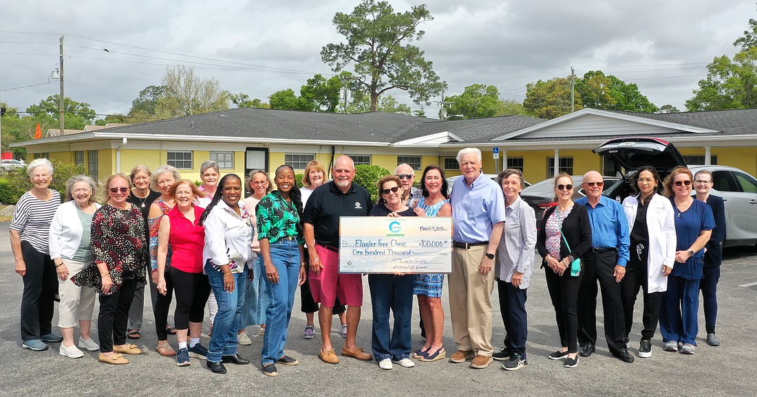 Hammock Dunes Cares presented a $100,000 donation to the Flagler Free Clinic on March 18. Courtesy photo