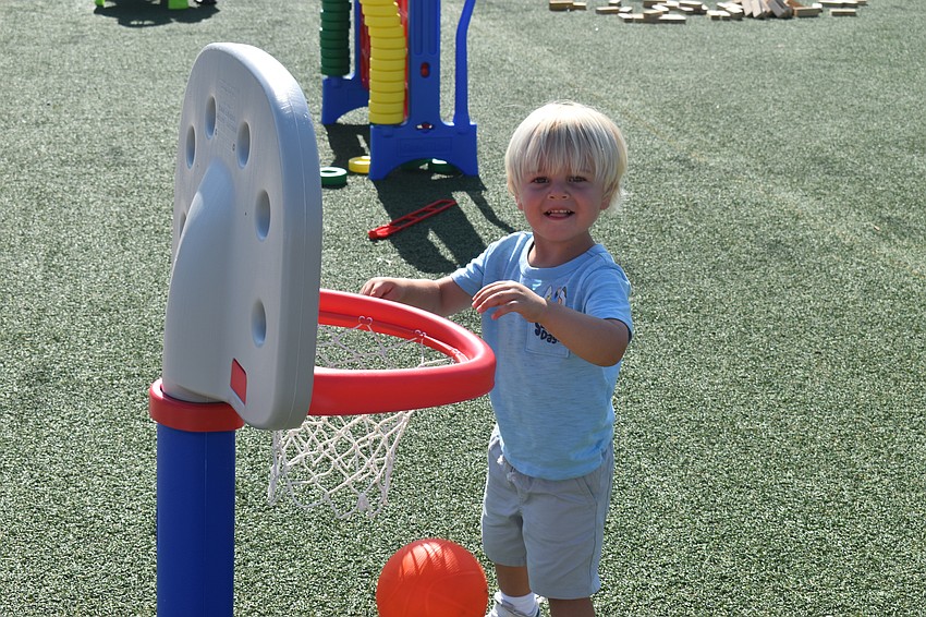 Lakewood Ranch 3-year-old August Barnett was all smiles after making a basket at UTC Kids Club Wednesday.