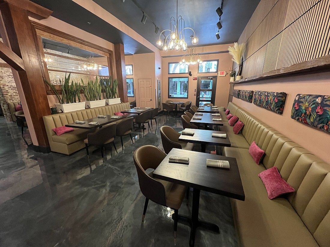 One of two interior dining rooms at Dorothy's Downtown that feature long banquettes along the wall.
