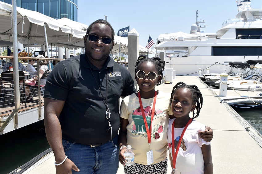 Georges Nicolas brought his daughters Isabelle Nicolas, 10, and Ariann Nicolas, 8, to work.