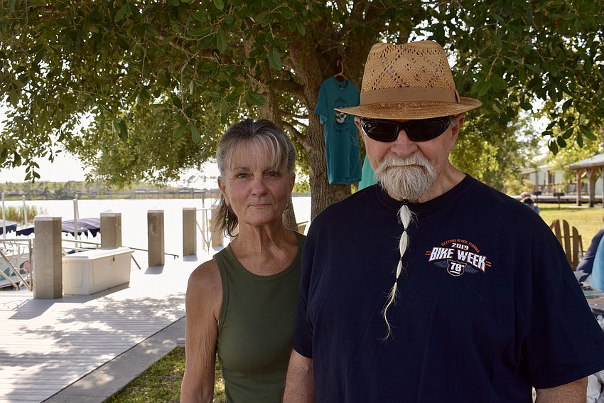 East County's Terry Williams and Mick Lutz are at Jiggs Landings to hear Steve Arvey play. Lutz makes cigar box guitars.