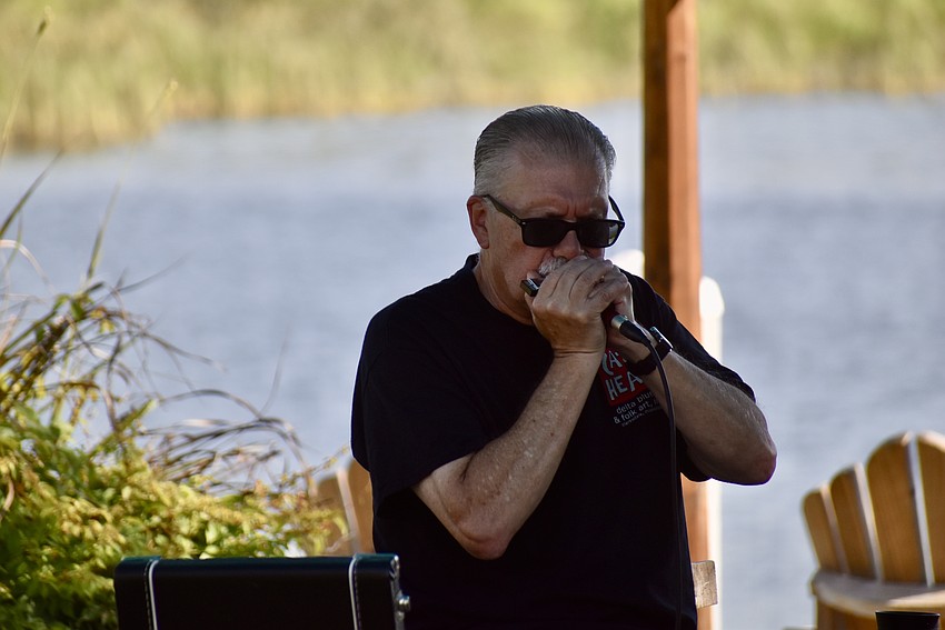 Miguel Primero plays the harmonica.