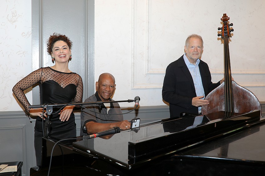 Actress Josephine Phoenix sings with accompanists Scotty Wright and Michael Ross.