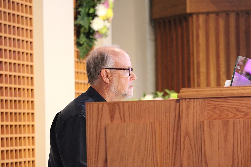 Organist John Behnke plays the newly installed pipe organ at a celebration of St. Armands Key Lutheran Church's rebuilding from the hurricanes.