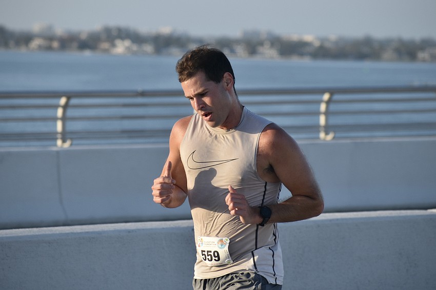 Brandon Bontrager heads across the bridge.