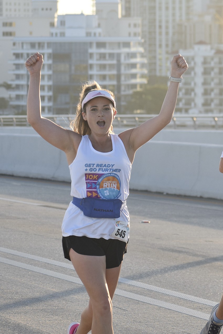 Katelyn Garner cheers shows some spirit along the race course.