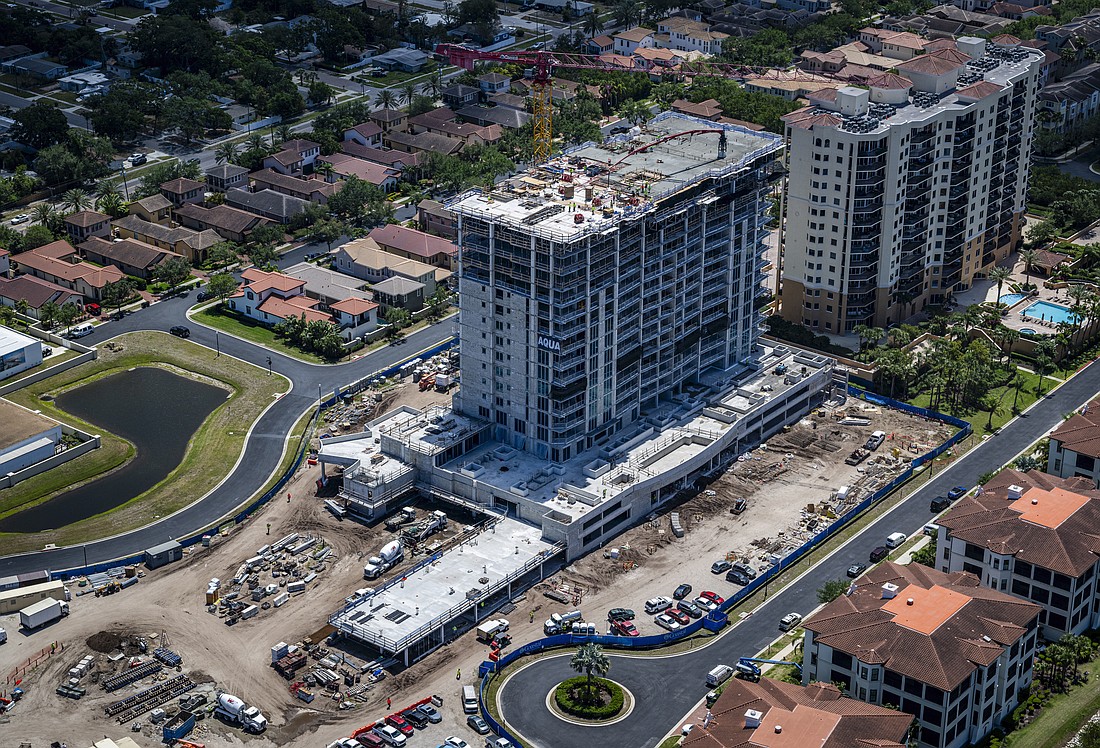 The first tower for AQUA, a three tower condominium complex at the Westshore Yacht Club, recently topped out.