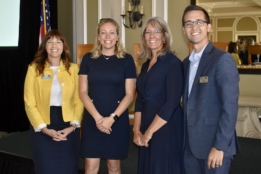 Julie Fanning and Brittany Lamont from the Lakewood Ranch Business Alliance stand with guest speakers Laura Cole, vice president of Lakewood Ranch, and Philip Reber, COO of Lakewood Ranch Medical Center.