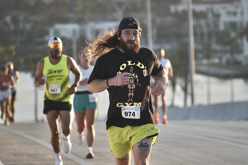 Christopher Ramos heads across the bridge.