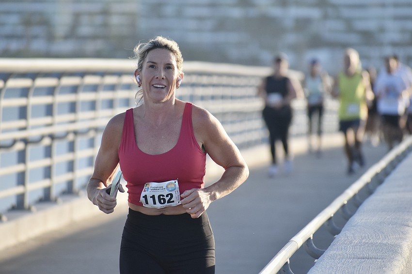 Becky Atluru races along the walkway.