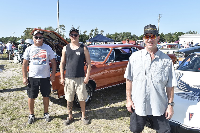 Willie Kreiiling and his son Billy Kreiling of Sarasota pose with their 1966 Pontiac GTO, alongside Joe Russo of Bradenton, with his 1981 Pontiac Trans Am.