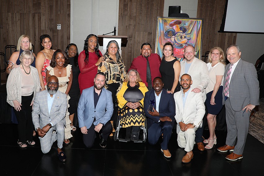 The Visible Men Academy staff and board members gather for a photo at the Shine On gala held on April 25 at The Ora with 165 guests in attendance.