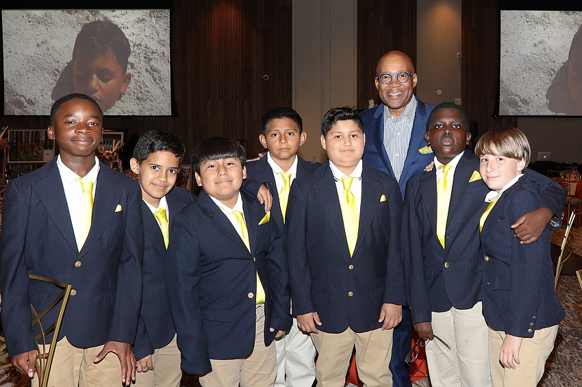 Shine On gala paddle raiser Don Frieson with VMA students Sammy Louis-Gene, Melkis Ruiz, James Carrizo, Orlando Benetiz, Marvin Flores, Feinley Louidor and Wyatt Morton