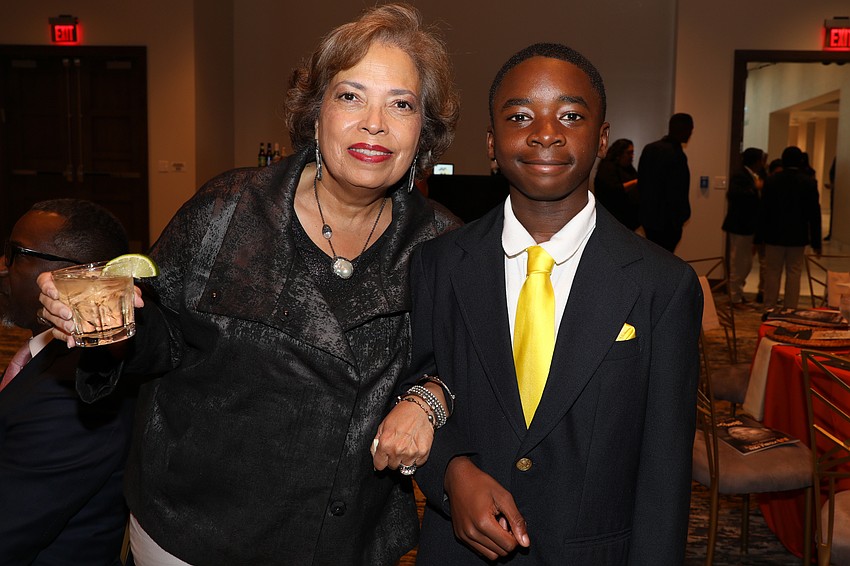 Linda Woods is escorted into the VMA Shine On gala by Samuel LouisGene.
