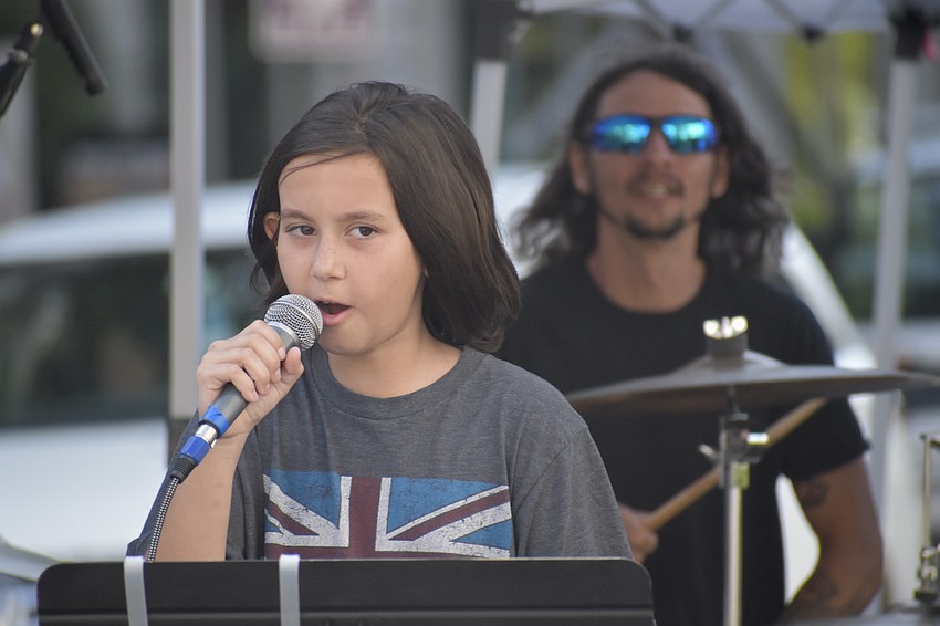 Lily Reid, 10, and her father Matt Reid, perform with Music Compound.