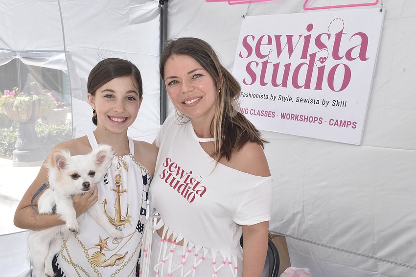 Arabella Surline, 11, a student at Sewista Studio, and her dog Wilbert, pose with owner Anna Ostrovskiy.  

Ostrovskiy said today, sewing isn't widely taught like it was when she was growing up. 


