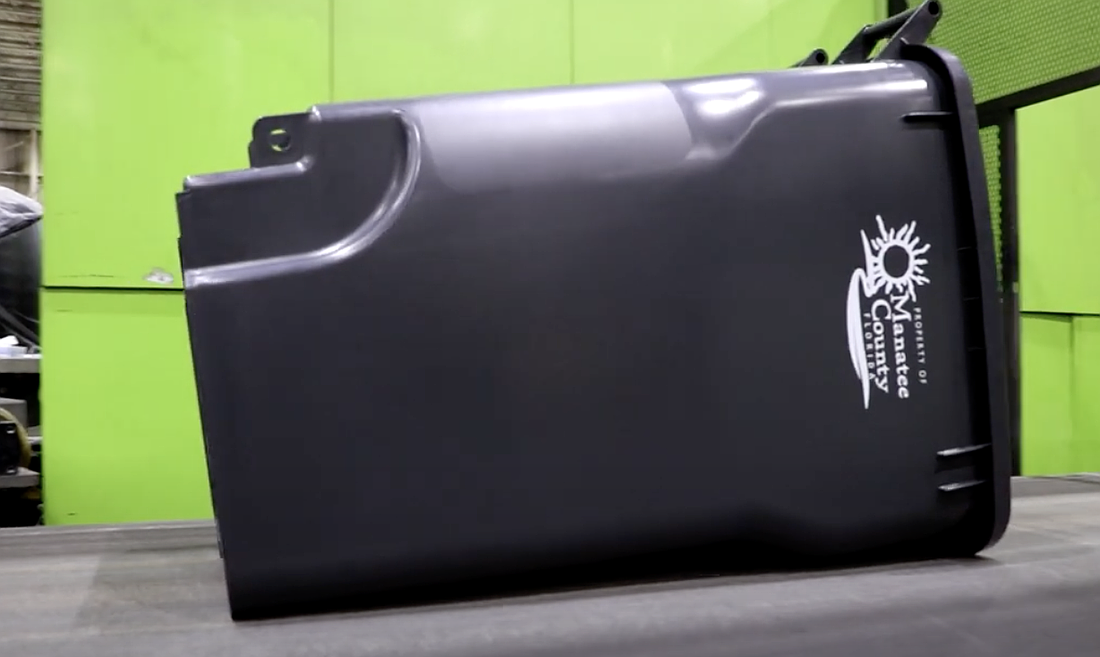 96-gallon trash bins are rolling off the assembly line, bound for Manatee County.