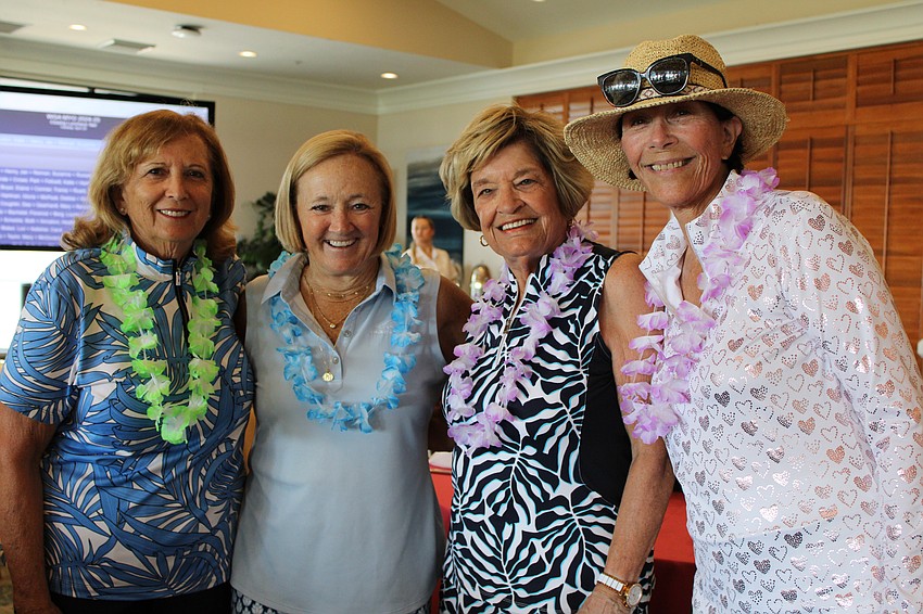 Arleen Klein, Marlene Wilkening, Becky Smothers and Elaine Cichon join in a festive luau celebration for the Women's Golf Association of Longboat Key farewell for the season.