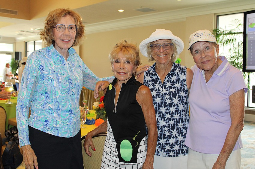 Pam Reiter, Ruthellen Rubin, Betsy Granite and Marge Heller join in the fun after a few rounds on the green at the Women's Golf Association of Longboat Key end-of-season party.