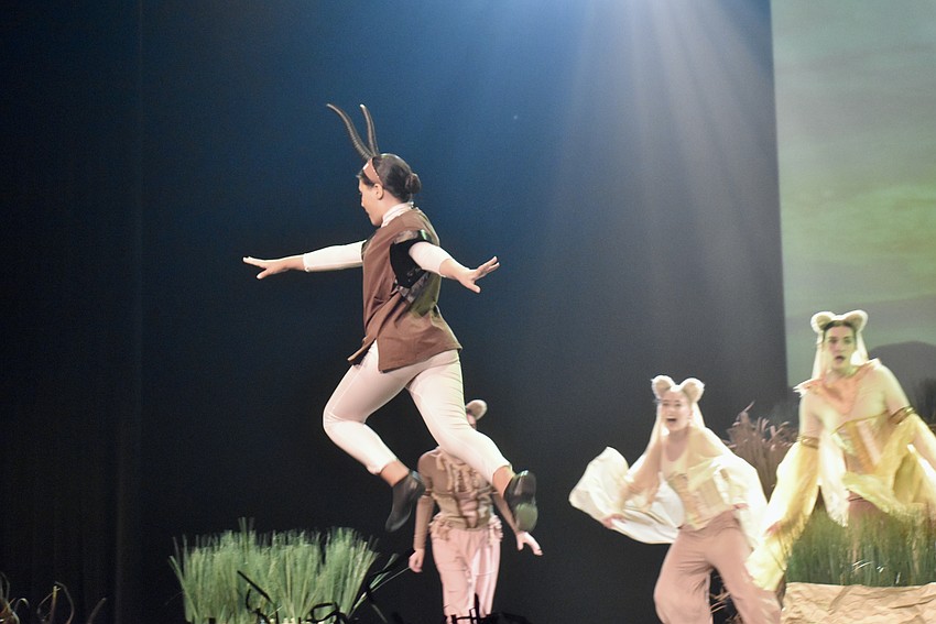 A gazelle leaps across the stage during Act I.