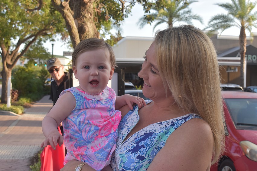 Victoria LaPlante and her 1-year-old daughter Chloe LaPlante visit Lakewood Ranch Main Street from Boston and dance along to the blues. They share the same blue eyes, eyes that Victoria described as 