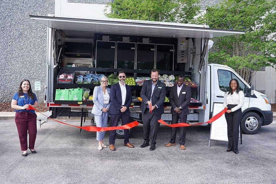 Second Harvest celebrates the ribbon-cutting for its new mobile farmers market. Courtesy photo
