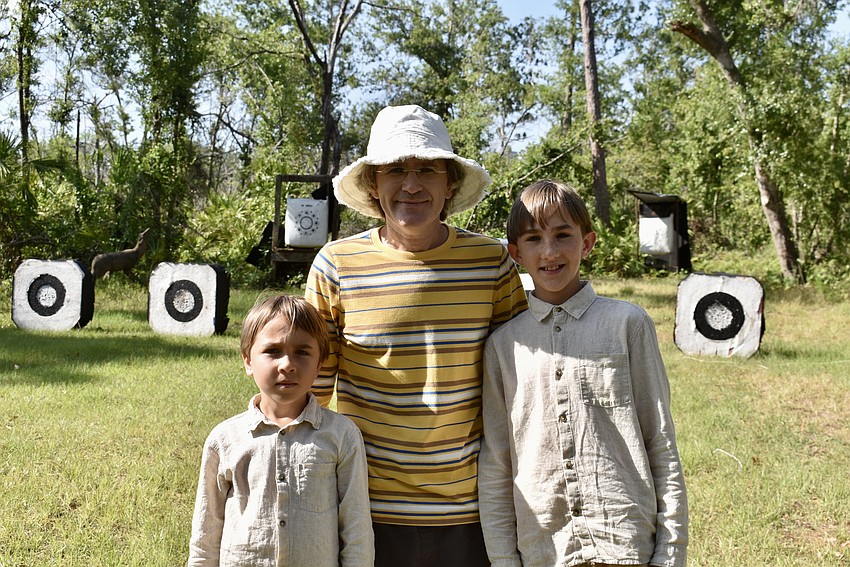 Sarasota's Isaac, Alexander and Abraham Bezu enjoy the archery program so much that the boys will be getting their own bows soon.