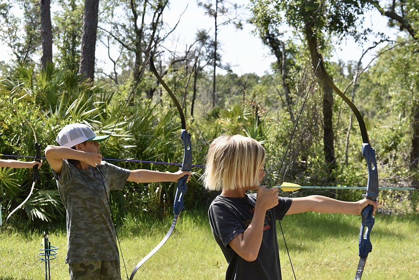East County's Zac Sharif, 11, and Bradenton's Paycen Rondenne, 13, set their sights on the bull's eye.